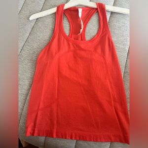 Lululemon tank in orange. Size 4.